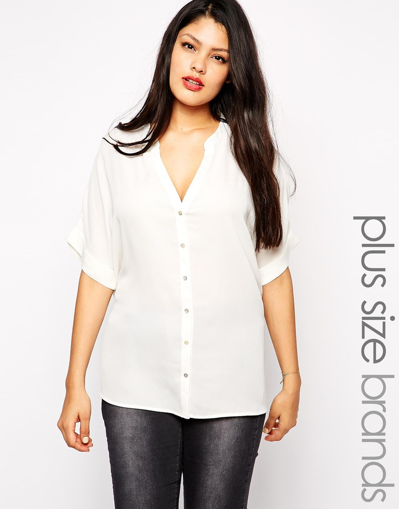 Blouse with Tie Back, $33 (was $76) This is one of those items — a sheer white blouse — that I find myself buying over and over and over again. Just counted and there are four in my closet that you can hardly tell apart. My friend Lisa has a million pairs of tall black boots. What's your repeat purchase?